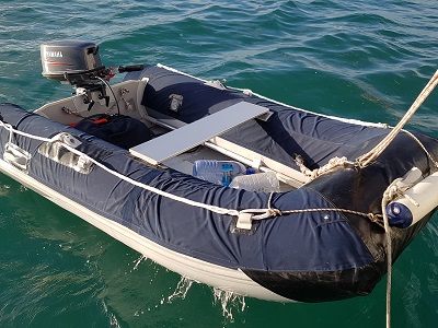 Our beautiful dinghy with it's cover is our trusted friend and part of the family. (We make sure to lock it ALL the time)