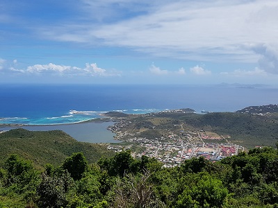 View to the Southeast of Saint-Martin, with Philipsburg behind the ridge and Saint-Barthélémy in the background.